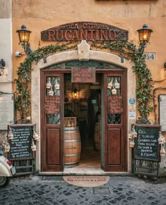 the entrance to an italian restaurant with wine barrels