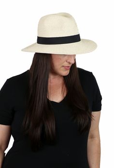 Get your hat-i-tude on with this classic wide brim fedora hat for women. Soft, comfy, crushable and packable with a 50+ UPF sun protection factor. A great summer travel hat with a sophisticated look. Scroll down for video! 3.5 inch brim in front shades your eyes and provides ample sun protection without being overpowering. Tapers slightly to 3 inches in the back to clear your collar and headrest while driving. 50+ UPF sun protection factor. Only 1/50th of the sun's UV radiation can penetrate thi Summer Fedora With Short Brim For Everyday, Classic Brimmed Boater Hat For Travel, Lightweight Brimmed Straw Hat For Everyday, Casual Fedora With Uv Protection For Travel, Everyday Lightweight Brimmed Straw Hat, Classic Fedora Panama Hat For Travel, Classic Panama Fedora Hat For Travel, Classic Panama Fedora For Travel, Classic Travel Panama Hat