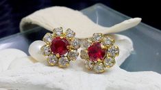 These earrings features a delicate Ruby Swarovski and Swarovski rhinestones set in 14k gold filled earrings. => Gemstone Type - Ruby Swarovski => Gemstone Size - 8mm; 8*4mm => Gemstone Cut - Faceted => Metal Type - 14k Gold Filled (Tarnish Resistant And Nickel Free) ♦ Replace the gemstone with many other gemstones we have in stock My another shops on Etsy http://www.CandySimpleJewelry.etsy.com http://www.CandyBohoJewelry.etsy.com  Important information **My customer service is available 7 days a Red Diamond Earrings With Accents For Wedding, Red Diamond Bridal Earrings As Gift, Red Round Cluster Earrings For Wedding, Ruby Earrings With Sparkling Stones For Gift, Red Ruby Diamond Earrings For Wedding, Formal Multi-stone Ruby Jewelry, Luxury Ruby Birthstone Earrings, Red Cubic Zirconia Birthstone Earrings, Red Heart-shaped Cubic Zirconia Earrings