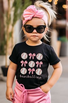 This BASEBALL SIS Bella and Canvas shirt is perfect for all those game days ahead!  This t-shirt is a feminine and trendy way to show your love for baseball season and your baseball sister season of life. PLEASE READ THROUGH ALL OF THE FOLLOWING INFORMATION.  IF YOU HAVE FURTHER QUESTIONS, WE ARE HAPPY TO HELP! Welcome to CuratedClothCo.!  Here you can find the perfect, trendy attire whether you are gifting for someone else or yourself.  We strive to provide quality merchandise and quick custome Baseball Shirt For Mom, Baseball Sister Outfit, Pink Tops For Baseball Game Day, Pink T-shirt For Baseball Season With Team Name, Pink Graphic T-shirt For Baseball Season, Pink Graphic Print T-shirt For Baseball Season, Black School Spirit Tops For Sports, Casual T-shirt For Cheerleading, Casual T-shirt For Cheerleading During Baseball Season