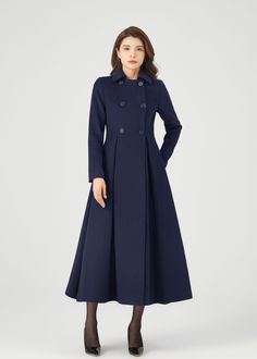 "FEATURES 50% wool, 50% wool blend Fully liner with polyester Two side pockets Lapel collar Long sleeve Button closure in front Fitted waist Navy wool coat Long wool coat For Winter, Autumn dry clean ★★Mode size Height 170cm (5′ 7″)  Bust 84 cm (33\")  Waist 66 cm (26\")  She wears size XS. ★★Bespoke Order Service If you Request other color Request the length Your height is not between 155 cm- 175 cm Your weight is not between 47 kg -77 kg I can do it for you, It will need some extra fee depending on on your need. Contact with me for more detail. ★★ Warmly Note: 1 ) : Please confirm your shipping address! If you wish to ship the item to a different address, please send me a message immediately after purchase. We can't change it after shipping, thank you for your understanding. 2 ) : Due to Tailored A-line Outerwear For Winter, Long Sleeve Wool Peacoat For Work, Winter Long Sleeve Peacoat For Work, Winter Peacoat For Workwear, Wool Peacoat For Workwear With Long Sleeves, Winter Workwear Peacoat With Long Sleeves, Solid A-line Outerwear For Work, Elegant Wool Coat With Pockets For Winter, Elegant Pea Coat With Stand Collar And Pockets