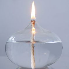 a candle that is inside of a glass bowl