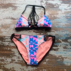 Fun, Bright Print Bikini! Get Ready For Summer! -Geometric Print With Fun Bright Colors -Multiple Small Elastic Pieces Combined For Strappy Detail On Sides Of Bottoms And Back Of Top -Top Pulls Over Head -Solid Black On Backside Of Bikini Bottoms -Good Coverage On Bikini Bottoms -Never Worn - Tags Attached - Top: Size Xs - Bottom: Size S Beachwear Swimwear With Triangle Top For Music Festival, Triangle Top Swimwear For Music Festival, Multicolor Summer Swimwear For Music Festival, Multicolor Beachwear For Music Festivals, Trendy Multicolor Swimwear For Music Festival, Pink Strappy Swimwear For Vacation, Trendy Pink Swimwear For Festival, Spring Music Festival Beachwear Swimwear, Pink Swimwear For Summer Music Festival