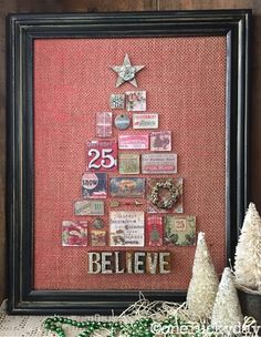 a christmas tree made out of different types of magnets on a bulletin board with the words believe