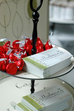 two tiered tray with cards and candy on it