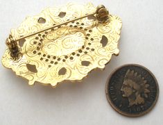 Vintage Fashion Jewelry - This is a gold tone brooch with an open work design, an oval cabochon center rhinestones and two faux pearls. It measures 1.75" by 1.25" and has the distinctive swirls of 1928 Jewelry Co on back. 1928 Jewelry, Pearl Brooch, Black Rhinestone, Oval Cabochon, Faux Pearl, Brooch Pin, Gold Tones, Fashion Jewelry, Vintage Fashion