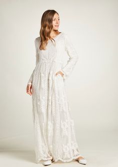 This adorable maxi dress is fully lined, a great modest wedding dress or an LDS temple-ready wedding dress. This boho style is very elegant, with a beautiful lace embroidery in cotton over tulle. It is comfortable and drapes nicely. It features a round neckline with fully lined sleeves and bodice. Long dress has 2 pockets in each side and no zipper just pull on quick and easy. The dress comes in sizes XS, S/M, M/L, XL and XXL Fabric: Tulle with embroidery 100% cotton Fully lined: 100% Polyester Lace Maxi Dress With Floral Embroidery For Wedding, Flowy Lace Maternity Maxi Dress, Bohemian Maxi Dress With Floral Embroidery For Wedding, Flowy Maxi Dress With Lace Bodice, Floor-length Lace Maxi Dress With Floral Embroidery, Modest Flowy White Maxi Dress, Floral Embroidered Lace Floor-length Maxi Dress, Modest Lace Dress With Lace Sleeves, Flowy Long Maxi Dress With Lace Trim