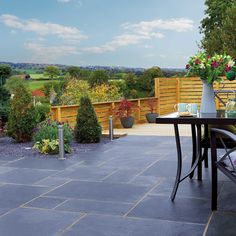 Black Limestone Paving Slabs   Kadapha Black Limestone is a firm favourite amongst many Landscapers and homeowners. The performance and characteristics of limestone paving combined with the beautiful blue-black colouring make Black Kadapha an easy choice for many paving projects. Durable, Hard-wearing and Versatile Limestone is very durable, making it ideal for garden and patio paving projects. It is slightly permeable, but water absorption tends to be limited, making limestone great for outdoor paving. Limestone offers flatter and smoother stone textures when compared to sandstone paving, with fewer ridges in its finish. Whilst being very durable and incredibly hard-wearing, actually, by masonry standards limestone is a “soft stone”, so it is easy to cut and lay - a property that makes th Limestone Patio, Patio Paving, Limestone Paving, Gas Fire Stove, Space Saving Baths, Sandstone Paving, Corner Sink Kitchen, Concrete Paving, Electric Underfloor Heating