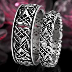 two silver rings with celtic designs on them, one has a diamond in the middle