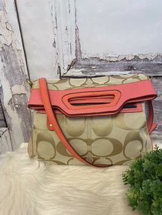 Coach Khaki/Coral Bonnie Fold Over Crossbody Bag 13393. A few marks near top on patent leather and leather, Check photos. Inside is clean with two pocket sleeves and zip comp. Snap closure Goldtone hardware Measures 14”H from top of handle to bottom of bag 12”L Up to 21” adjustable shoulder strap drop Buyer must make payment within two days after purchase. Coach Shoulder Satchel With Zipper Closure, Coach Satchel Shoulder Bag With Zipper, Coach Satchel With Zipper Closure As Shoulder Bag, Coach Crossbody Shoulder Bag With Zipper Closure, Coach Crossbody Shoulder Bag, Coach Crossbody Shoulder Bag With Zipper, Coach Crossbody Satchel With Adjustable Strap, Coach Shoulder Bag With Removable Pouch For On-the-go, Detachable Handle Crossbody Shoulder Bag