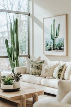 a living room filled with furniture and a large cactus