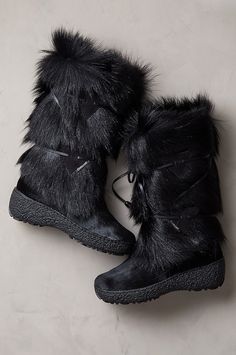 Gone are the days when you had to choose between styled or weatherproofed. The Anna boots let you have it all in winter footwear that's fashioned for beauty and built to conquer the elements. Handcrafted in a premium goat fur shaft, this feminine boot features a soft, smooth, calfskin hair-on leather shoe in fine contrast to the fluffy goat fur shaft that's detailed with a leather lace-up front. Our snow-proof, water-repellent boot features a genuine wool lining throughout the shaft, shoe and fo Luxury Sheepskin Boots With Suede Lining, Luxury Shearling Boots With Round Toe, Luxury Cap Toe Boots For Winter, Luxury Boots With Faux Fur Lining And Round Toe, Luxury Sheepskin Boots With Faux Fur Lining, Anna Boots, Fluffy Goat, Feminine Boots, Waterproof Suede Boots