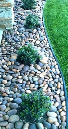 a garden path made out of rocks and grass