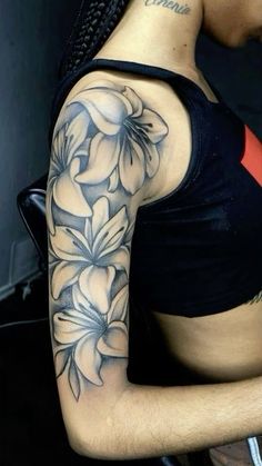 a woman with a flower tattoo on her arm