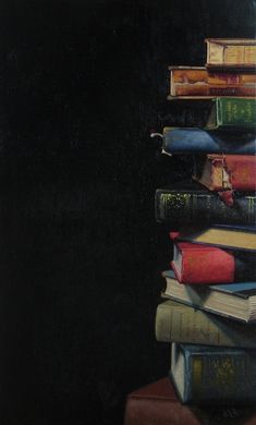 a stack of books sitting on top of each other in front of a black background