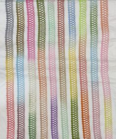 a multicolored piece of cloth with wavy lines on it