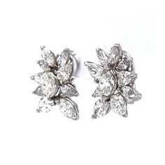 These sparkling Pear & Marquise Diamond Cluster Stud Earrings are crafted in shimmering platinum. A collection of marquise and pear cut diamonds are set in a unique floral motif. The diamonds weigh a total of 7.90 carats. These diamond studs would make terrific jewelry for a wedding or formal event. Finished in durable platinum. Modern Jewelry with a timeless diamond design! Anniversary Marquise Diamond Cut Cluster Earrings, Silver Marquise Diamond Cut Cluster Earrings, Diamond Cluster Earrings For Anniversary, Marquise Shape, Formal Marquise-cut Earrings With Diamond Accents, Formal Marquise-cut Diamond Cluster Earrings, Pear Cut Diamond, Marquise Diamond, Shop Engagement Rings, Diamond Design