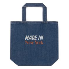 "Durable organic denim tote bag will easily hold your all your essentials. The long handles will provide extra comfort while the inside pocket will hold and hide your smaller valuables. * 100% organic cotton * Embroidered New York Logo * Maximum weight limit: 30 lbs * Double-stitched top seam * Cross stitching on handles for more stability * Small inside pocket ✨HOW TO ORDER: Select size and color, Add to the cart, Choose the payment method, proceed to checkout, and continue as a guest if you don't have an Etsy account. 🚚PROCESSING TIME & SHIPPING * SHIP DATE: All items are customization. Our processing time is 3-5 business days. This will change during peak seasons. * Please note: the \"ship by\" date on your invoice is NOT equivalent to the actual \"delivery\" date. - SHIP BY DATE: When City Typography, New York Logo, Denim Tote Bags, Ny City, Denim Tote, Embroidered Denim, Great T Shirts, The Ship, Cross Stitching