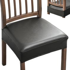 a black leather chair with wooden frame and back