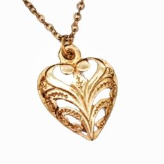 This is a sweet and elegant heart necklace.  It is small and understated, yet detailed and ornate.  A beautiful gift to someone you love.  Gold chain is 18 inches long. Elegant Brass Necklaces For Valentine's Day, Elegant Brass Heart Necklace, Elegant Heart-shaped Brass Necklace, Dainty Heart-shaped Brass Jewelry, Elegant Charm Necklaces With Vintage Charm As Gift, Dainty Heart-shaped Brass Necklaces, Valentine's Day Gold Necklace With Intricate Design, Elegant Heart-shaped Jewelry With Vintage Charm, Vintage Gold Plated Charm Necklace As Gift