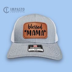 The perfect hat to honor our mothers! Blessed Mama. High quality engraved leather patch trucker hat. Richardson 112: Fabric: Cotton-Poly/Nylon Mesh Visor: Pre-curved Sweatband: Cotton Fit: Adjustable Snapback Size: One Size Fits Most Adjustable White Trucker Hat With Leather Patch, White Trucker Hat With Leather Patch, Adjustable Hats With Leather Patch As Gift, Adjustable Gray Hat For Gift, Brown Curved Bill Hat For Gift, Father's Day Gift Trucker Hat With Curved Brim, Leather Patch Cap Hat Gift, Leather Patch Cap - Gift, Leather Patch Cap As Gift