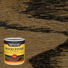 a can of minwax wood finish sitting on top of a wooden flooring