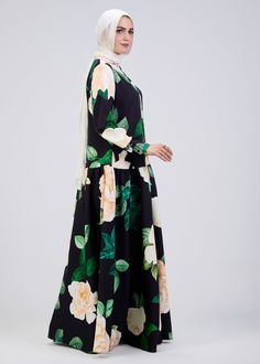 Elevate your wardrobe with this stunning floral print button-front maxi dress, crafted from durable crepe fabric for long-lasting comfort and elegance. The soft black base is adorned with a vibrant floral pattern, making it a standout piece for any occasion. Designed with a modest fit, this dress features a belted waist and tiered skirt, providing a flattering silhouette that flows gracefully with every movement. The button-front design adds a touch of sophistication, while the long sleeves ensu Button Front Maxi Dress, Modest Fits, Abaya Dress, Button Front Dress, Floral Print Maxi Dress, Floral Print Maxi, Dress Satin, Button Dress, Crepe Fabric