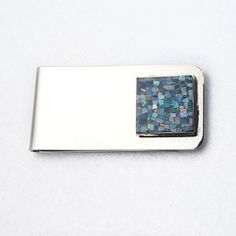 "A natural stone inlay of an opal mosaic adorns this nickel silver money clip. The gemstone inlay of 16mm (.62\" inch) is bezel set in sterling silver. 2\" inch in length. Handmade in the USA." Silver Agate Bracelets For Gifts, Modern Polished Silver Gemstones, Luxury Silver Gemstones For Gifts, Silver Jewelry With Rectangular Natural Stones, Luxury Polished Silver Gemstones, Modern White Gold Gemstones For Gift, Elegant Nickel-free Silver Gemstones, Rectangular Silver Gemstones For Gifts, Elegant Silver Agate Gemstones