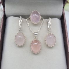 This Jewelry set comes with a 100% Natural Pink Rose Quartz by Gemstone, and it is made up of 925 solid sterling silver. This Jewelry set is handcrafted by our skilled craftsmen and designed by us. Every gemstone is handpicked for the best quality. Material :- Silver (925 Solid Sterling Silver) Gemstone :- Natural Pink Rose Quartz  All Item Weight :- 11.00 Garam Approx. Stone Shape :- Oval Cabochon Gemstone Size :- 10x14 MM Payment Policy :- We accept payment through PayPal. All payments must be Pink Jewelry Sets With Matching Round Earrings, Pink Jewelry Sets With Matching Earrings, Pink Jewelry Sets For Gifts, Formal Pink Round Jewelry Sets, Elegant Pink Sterling Silver Jewelry Sets, Hallmarked Rose Gold Sterling Silver Jewelry, Pink Fine Jewelry For Mother's Day, Mother's Day Fine Pink Jewelry, Mother's Day Pink Fine Jewelry