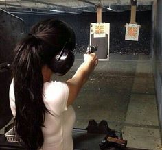 a woman with headphones on taking a photo