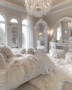 a bedroom with white fur on the floor and chandelier