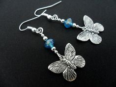 A pair of hand made tibetan silver & blue crystal bead dangly butterfly  earrings. new. Nickel-free Adjustable Butterfly Earrings, Silver Butterfly Charm Drop Earrings, Handmade Metal Butterfly Earrings, Handmade Butterfly Metal Earrings, Adjustable Drop Earrings With Butterfly Charm, Silver Drop Earrings With Butterfly Charm, Nickel-free Butterfly Shaped Silver Earrings, Nickel-free Silver Butterfly Earrings, Blue Butterfly Charm Dangle Earrings