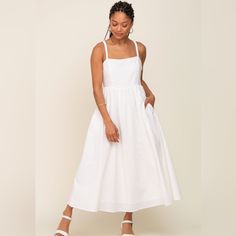 A Linen Midi Dress Featuring A Square Neckline, Elastic Straps, A Lace-Up Back, A Side Zipper, Side Pockets, An A-Line Skirt And Double Lining. Content + Care Self: 55% Cotton 45% Linen Lining: 100% Rayon Summer Midi-length Unlined Dresses, Summer Midi Length Unlined Dress, Unlined Maxi Length Dress For Brunch, Unlined Midi Summer Dress, Unlined Cotton Sundress Midi Dress, Spring Midi Length Sundress, Unlined, Unlined Cotton Midi Sundress, Spring Midi Length Unlined Sundress, Unlined Sundress Midi Dress For Day Out