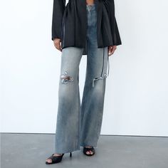 High-Waisted Jeans With 5 Pockets.Washed Effect. Front Ripped Detail. Chic Ripped Jeans, Chic Ruched Bottoms For Fall, Chic Ruched Bottoms For Day Out, Zara Fitted Jeans For Day Out, Chic Spring Jeans By Zara, Chic Ripped Bottoms For Night Out, Chic Zara Jeans For Day Out, Zara Wide Leg Jeans, Black Flare Jeans