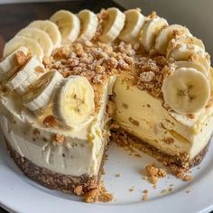 there is a cake with banana slices on the top and crumbs all over it