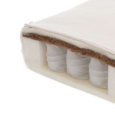 the inside of a mattress with three baby shoes on it's bottom and side