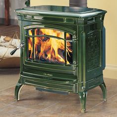 a green stove sitting inside of a living room