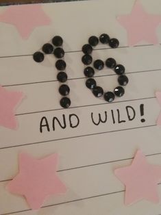 a piece of paper with the words 50 and wild written on it, surrounded by stars