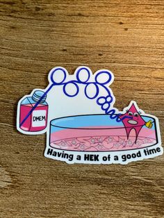 a sticker that says having a heft of a good time on the side of a wooden table