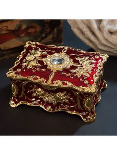 a red and gold box sitting on top of a table