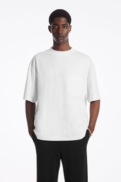 The Heavy Duty T-shirt is a big step up from your classic jersey tee. Weighing in at a substantial 290gsm, it's made with Circulose® and premium organic cotton that's hefty, warm and holds the boxy shape in place. It's designed with a mock neck, dropped shoulders and a casual patch pocket at the chest – perfect for hooking your sunglasses onto.- Oversized fit, 290gsm- Side slits, stepped hem- Organic cotton is grown from non-genetically modified seeds without chemical fertilizers or pesticides70 Genetically Modified, Jersey Tee, Tshirts Online, Step Up, Shirt Online, Oversized Fits, Mock Neck, Brand Logo, Cotton Tshirt