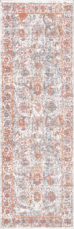 an orange and white rug with many different colors