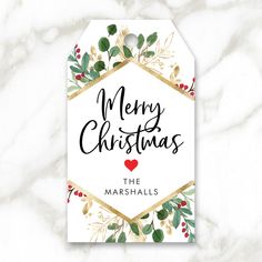 merry christmas card with gold foil and holly leaves on marble background, featuring the words'merry christmas '