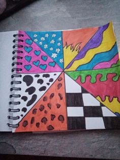 a notebook with different colored designs on it