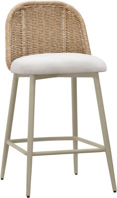 a wicker bar stool with a white cushion on the seat and backrests