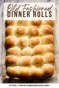 a loaf of bread that has been baked and is sitting in a baking pan with the words old fashioned dinner rolls on it