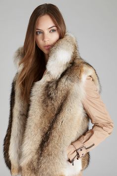 Layer our coyote fur vest with stand up collar over your fall sweater, denim jacket or winter coat for extra style and warmth. Stand up or fold down collar Slit pockets Satin lining Hook & eye closure Length: 22 in/55 cm Fur Chair, Fox Fur Vest, Fox Fur Jacket, Coyote Fur, Fabulous Furs, Fox Fur Coat, Collars For Women, Fur Fashion, Fur Vest