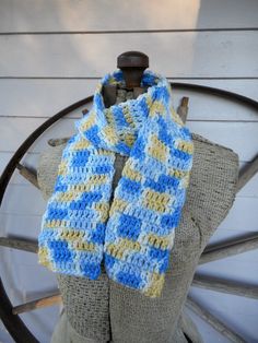 "Handcrocheted Boho \"The Neverending Storm: Mountain Top\" Scarf Colors are: Delft Blue, Cornflower Blue, Lemon & White Double crocheted for stretchiness & non sweating. This scarf is 48\" long x 4\" wide. We have a pair of matching gloves in the shop & also check out our Neverending Storm Necklace right this way: https://www.etsy.com/listing/467701504/the-neverending-storm-mountain-top?ga_search_query=blue&ref=shop_items_search_48 all our items come from a smoke & pet-free Blue Hand-knitted Yarn Patterns, Storm Mountain, Blue Cornflower, Scarf Handmade, Scarf Neck, Delft Blue, Mountain Top, Neck Wrap, Cornflower Blue