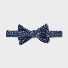 Update your formal accessories collection with this Bow Tie from Goodfellow & Co™. This stylish bow tie made from lightweight material with partial lining offers comfortable wear. It features a pre-tied style with an easy-close fastener for simple on and off. Pair it with your favorite dress shirt and suit jacket to complete your formal look. Goodfellow & Co™: Where style & fit are always in good company Spring Black Tie Adjustable Bow Tie, Navy Formal Ties For Summer, Dapper Formal Ties For Spring, Spring Dapper Adjustable Bow Tie, Dapper Spring Formal Ties, Dapper Adjustable Bow Tie For Spring, Formal Spring Dapper Ties, Summer Party Bow Tie With Detachable Bow, Summer Black Tie Bow Tie With Satin Bow