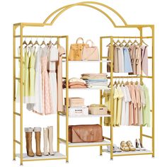 an open closet with clothes, shoes and handbags